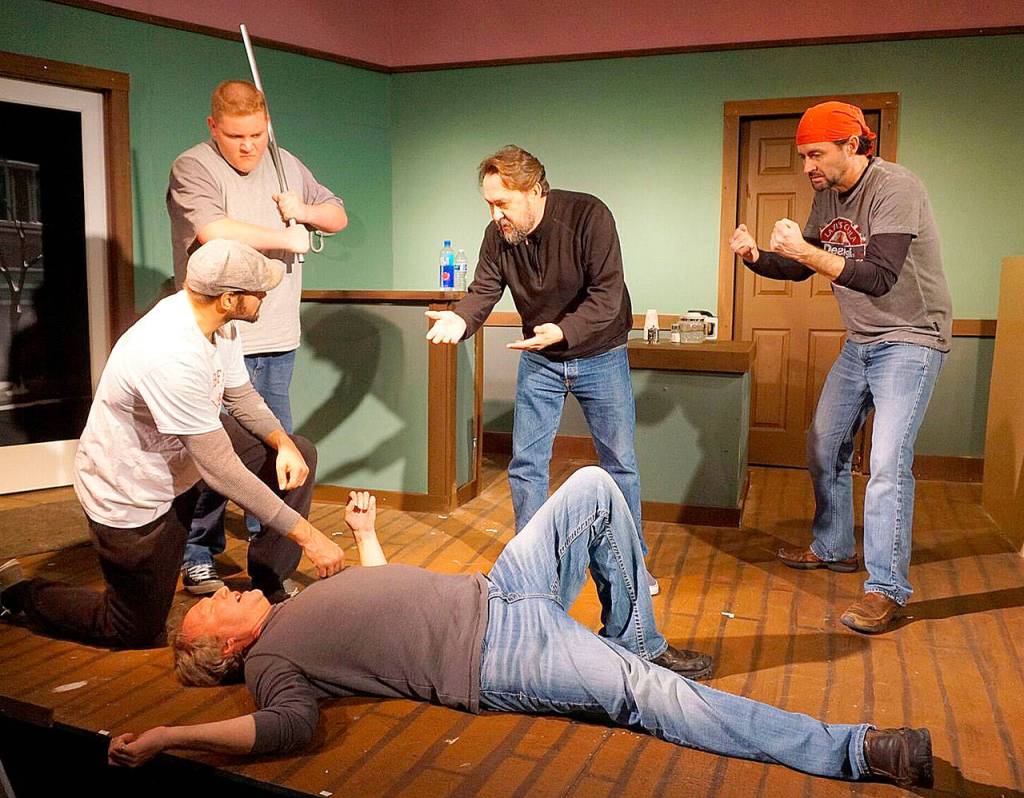 Michael Gavronski, Carson Boyle, Michael Murdock and Brenden Ellwood, gather around Peter Cook, who&rsquo;s just been knocked down, in a scene from the play.                                 Photo courtesy of René Schuchter