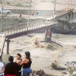 A bridge in Chaclacayo is left broken and twisted because of heavy flooding. (Courtesy Photo)