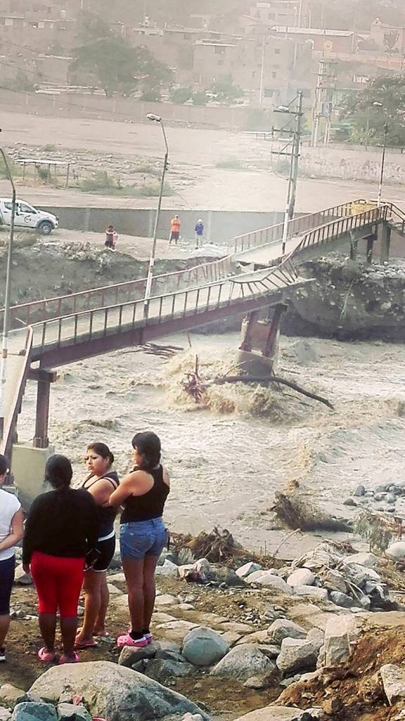 A bridge in Chaclacayo is left broken and twisted because of heavy flooding. (Courtesy Photo)
