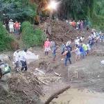 Citizens in Chaclacayo, Peru, work together to clear away debris from damage caused by flooding and mudslides. (Courtesy Photo)