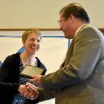Emily Larson accepts the Elementary Educator of the Year award from Snoqualmie Valley School District Superintendent Joel Aune March 23 at the Snoqualmie Valley Schools Foundation luncheon. Carol Ladwig/Staff Photo