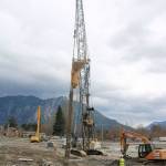 Compressed air spurts from a 35-foot hole drilled in front of Mount Si High School. The crane operator used the air to compress the soil and stones being fed into the column, designed to stabilize the new school in an earthquake. (Evan Pappas/Staff Photo)