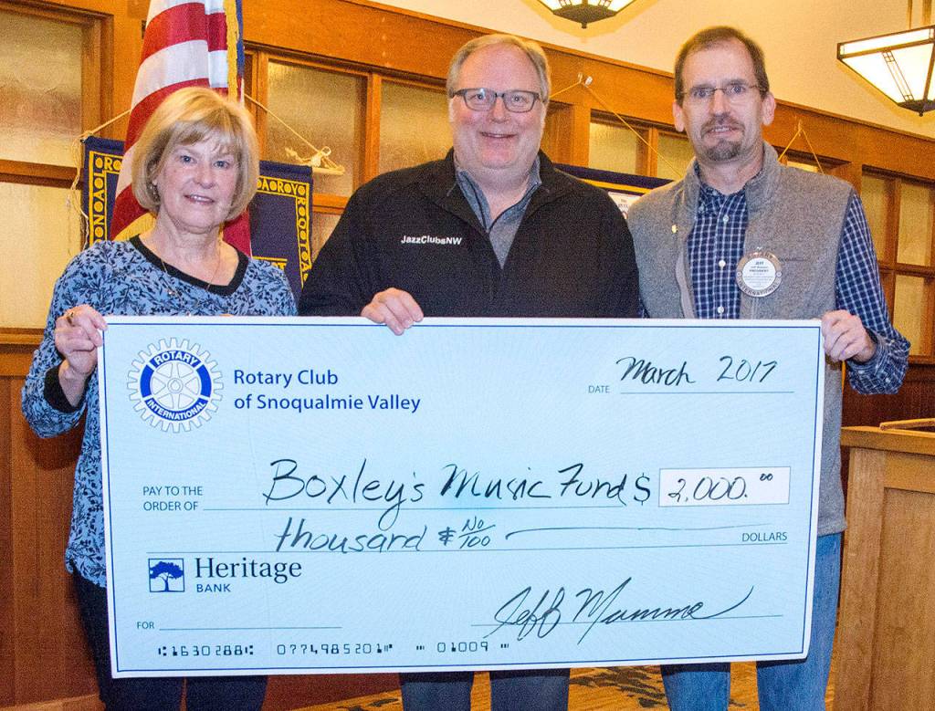 Boxley Music Fund, also known as Jazz Clubs NW, was one of the community organizations to be awarded a 2017 Rotary Grant. Rotary members Nancy Whitaker, left, and President Jeff Mumma, right, presented the award to Jazz Clubs NW Executive Director Gregory Malcom March 23.                                Courtesy Photo