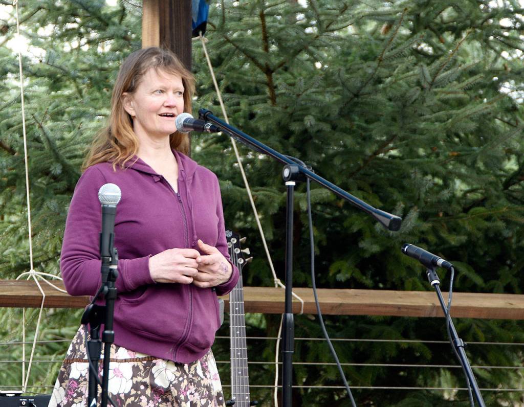 Parade organizer Betsy MacWhinney thanks all the parade participants for attending the first ever March of the Vegetables Saturday in Duvall.                                Carol Ladwig/Staff Photo