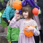 Colorful balloons gave this parade marcher a Carmen-Miranda-style hat.                                Carol Ladwig/Staff Photo