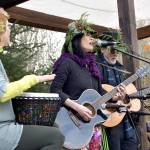 Maren von Nostrand accompanies Joan and Michael Shure during a musical performance in Depot Park following the March of the Vegetables parade.                                Carol Ladwig/Staff Photo