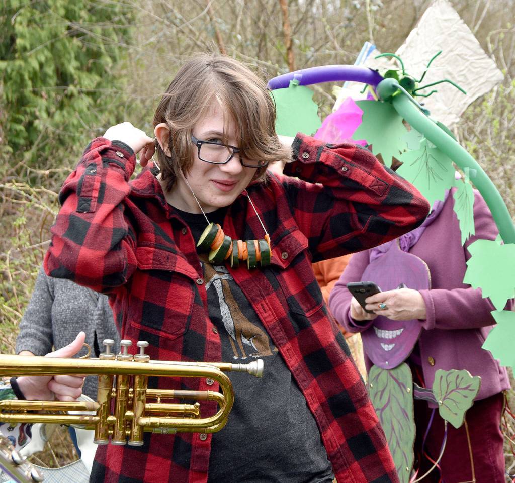 Erin Moore dons a veggie necklace for the March of the Vegetables celebration.                                Carol Ladwig/Staff Photo