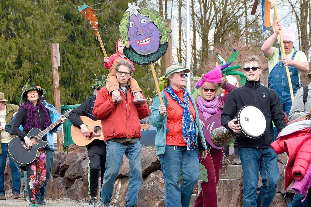 Vegetables, farmers and friends marched in Duvall Saturday