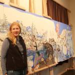 Kristen Lockwood is working on large mural featuring outdoor activities for the Opstad Elementary School gym. She plans to have the mural complete by October. (Evan Pappas/Staff Photo)
