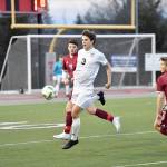 Reed Paradissis gets possession of the ball right at the beginning of the game. (Photo courtesy of Calder Productions)