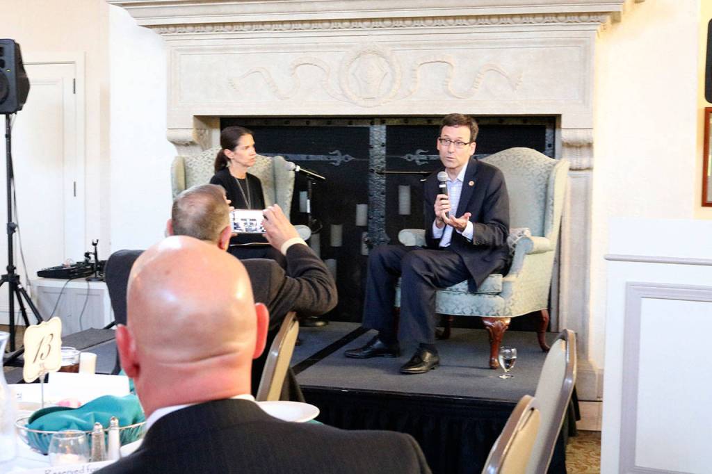Sound Cities Association (SCA) Executive Director Deanna Dawson and Washington State Attorney General Bob Ferguson speak at a SCA dinner in Kenmore. CATHERINE KRUMMEY / Kenmore Reporter