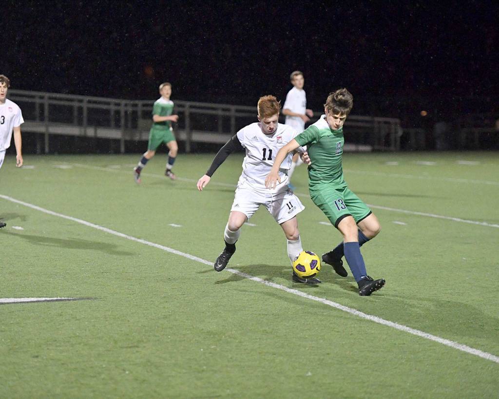 Kyle Hunter fights for the ball in the second half. (Photo courtesy of Calder Productions)