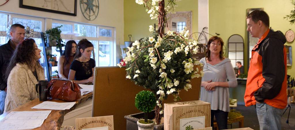 Downtown North Bend business owners gathered at Birches Habitat last Friday for a discussion of the city&rsquo;s plaza project with North Bend Assistant Public Works Director, Tom Mohr, far right.                                Carol Ladwig/Staff Photo