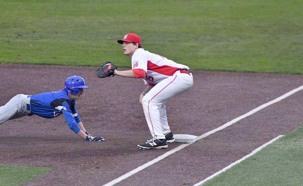 Michael Collins gets ready to catch a pass to stop the Bothell player&rsquo;s run. (Photo courtesy of Calder Productions)