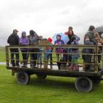 Despite the rain, families get into the basket in preparation for an afternoon hayride around Meadowbrook Farm. (Courtesy Photo)