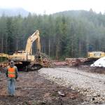 Workers look over the project site of the new Teneriffe trailhead this spring, when the project got underway. The new parking lot, with capacity for about 100 cars, and connecting trails are expected to be complete by July 1. (Evan Pappas/Staff Photo)