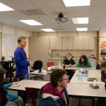 Para-educators sit with students of the Transition Learning Center as teacher Benjamin Bollinger explains the days lessons and activities.                                (Evan Pappas/Staff Photo)