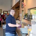TLC student Silas works at the Mount Si Senior Center, helping the kitchen staff with setting the tables and various other activities.                                (Evan Pappas/Staff Photo)
