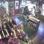 This surveillance photo shows the Friday night robbery of the Cascade Golf Course shop in progress.                                (Courtesy Photo)