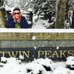 Walker with a Twin Peaks sign she found while in Whistler, British Colombia, in November. (Courtesy Photo)