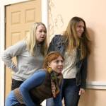 Three bridesmaids look out a window at the wedding reception below. From left: Natalie Collions playing Frances, Rachel Wilkie playing Meredith, and Penny McMillan-Hughes playing Trisha.                                (Evan Pappas/Staff Photos)