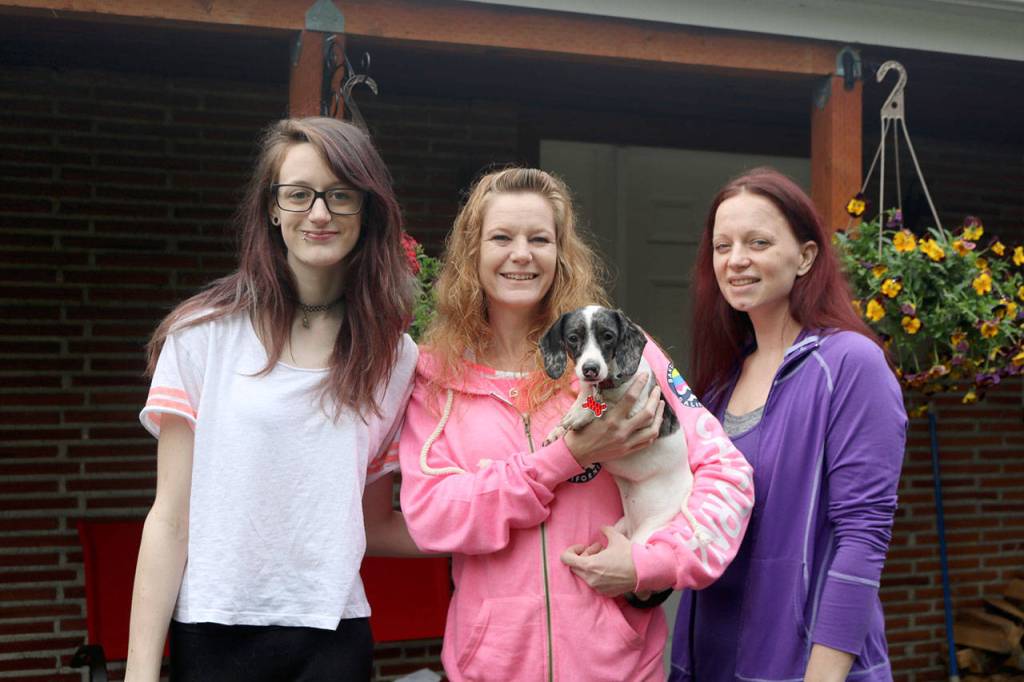 Wall to Wall home Cleaning was voted best home cleaning service. From left: Kaya Luttrell, Emma Luttrell holding their dog Jojo, and Jessica Phillips. (Evan Pappas/Staff Photo)