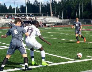 Mount Si defender Mateo Didomenico, left, puts pressure on Eastlake forward Bakary Sey in the first half of play. Eastlake outscored Mount Si 4-3 in an overtime penalty kick shootout to capture the victory in a loser-out playoff game on May 6 at Eastlake High School in Sammamish. (Shaun Scott/Staff Photo)