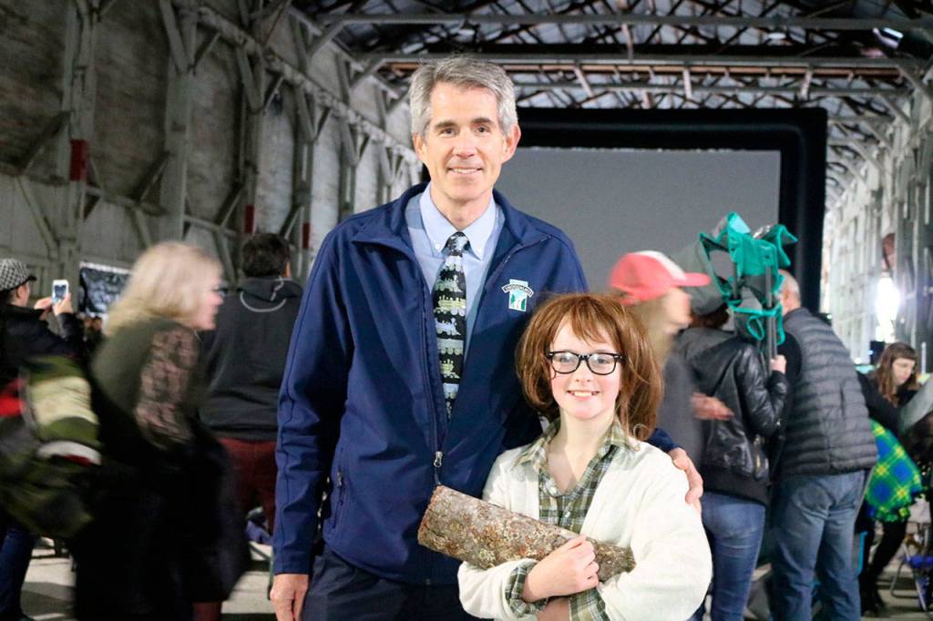 Snoqualmie Mayor Matt Larson and Kylie Allison from Portland, get a picture Together. Allison dressed as the Twin Peaks &ldquo;Log Lady&rdquo; for the event.                                (Evan Pappas/Staff Photo)