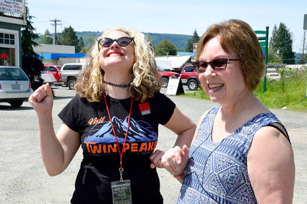 Tour guide and event coordinator Mary Hutter has fun with her group of &ldquo;Twin Peaks&rdquo; fans as they explore the Valley.                                (Mary Miller Photo)