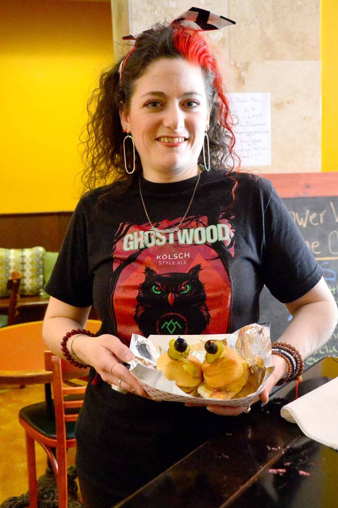 Shelley Woodward, owner of Selah Gifts, gets ready for the premiere.                                (Mary Miller Photo)