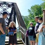 Mary Hutter leads a group on a tour of the various &ldquo;Twin Peaks&rdquo; filming locations throughout the Valley Sunday, as a precursor to North Bend&rsquo;s premiere party for the long-awaited season three.                                 (Mary Miller Photo)