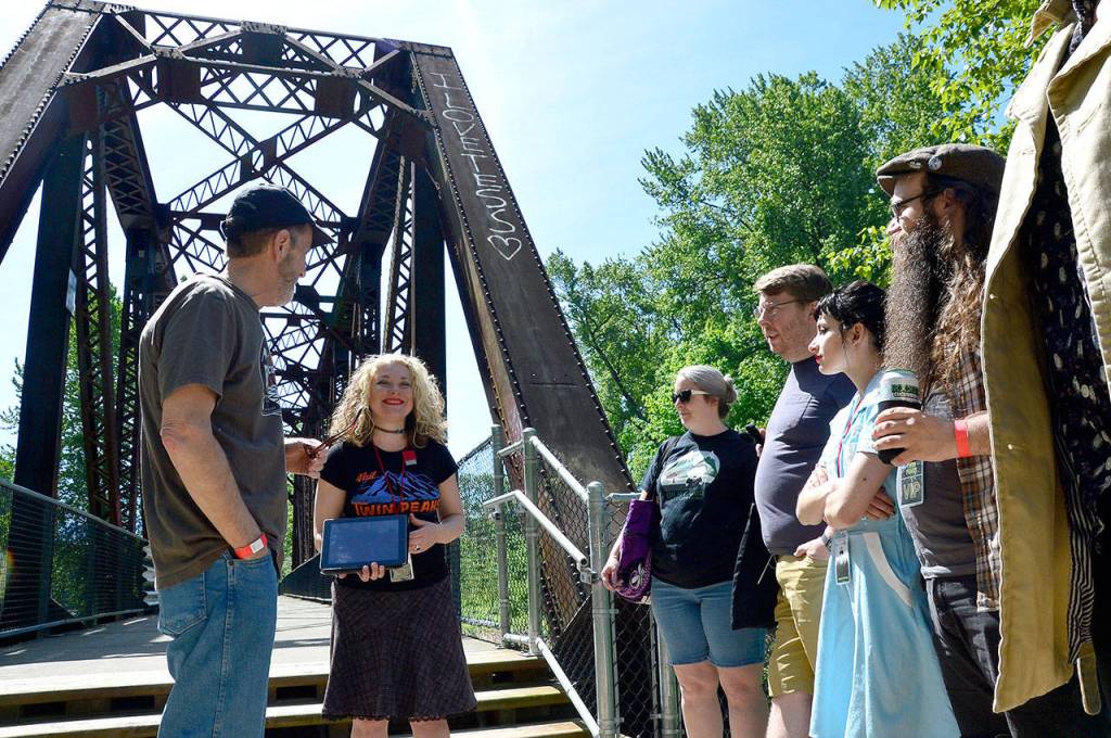 Mary Hutter leads a group on a tour of the various &ldquo;Twin Peaks&rdquo; filming locations throughout the Valley Sunday, as a precursor to North Bend&rsquo;s premiere party for the long-awaited season three.                                 (Mary Miller Photo)