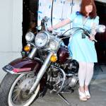 A Peaks fan poses for a photo with the original motorcycle used in the first season of Twin Peaks. It was brought to the premiere event by owner Arlie Becker.                                (Mary Miller Photo)