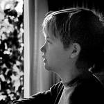 Middle schooler Nathaniel Raphael looks out the window in this first-place People photo by his father, Danny