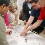 The Snoqualmie team examine the map of the city to plan their response to the mock earthquake.                                (Evan Pappas/Staff Photo)