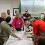 Snoqualmie staff discuss the steps needed to deal with a power outage.                                (Evan Pappas/Staff Photo)