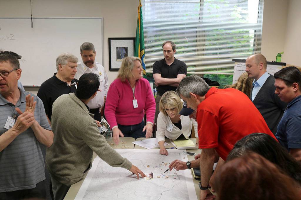 Snoqualmie staff discuss the steps needed to deal with a power outage.                                (Evan Pappas/Staff Photo)