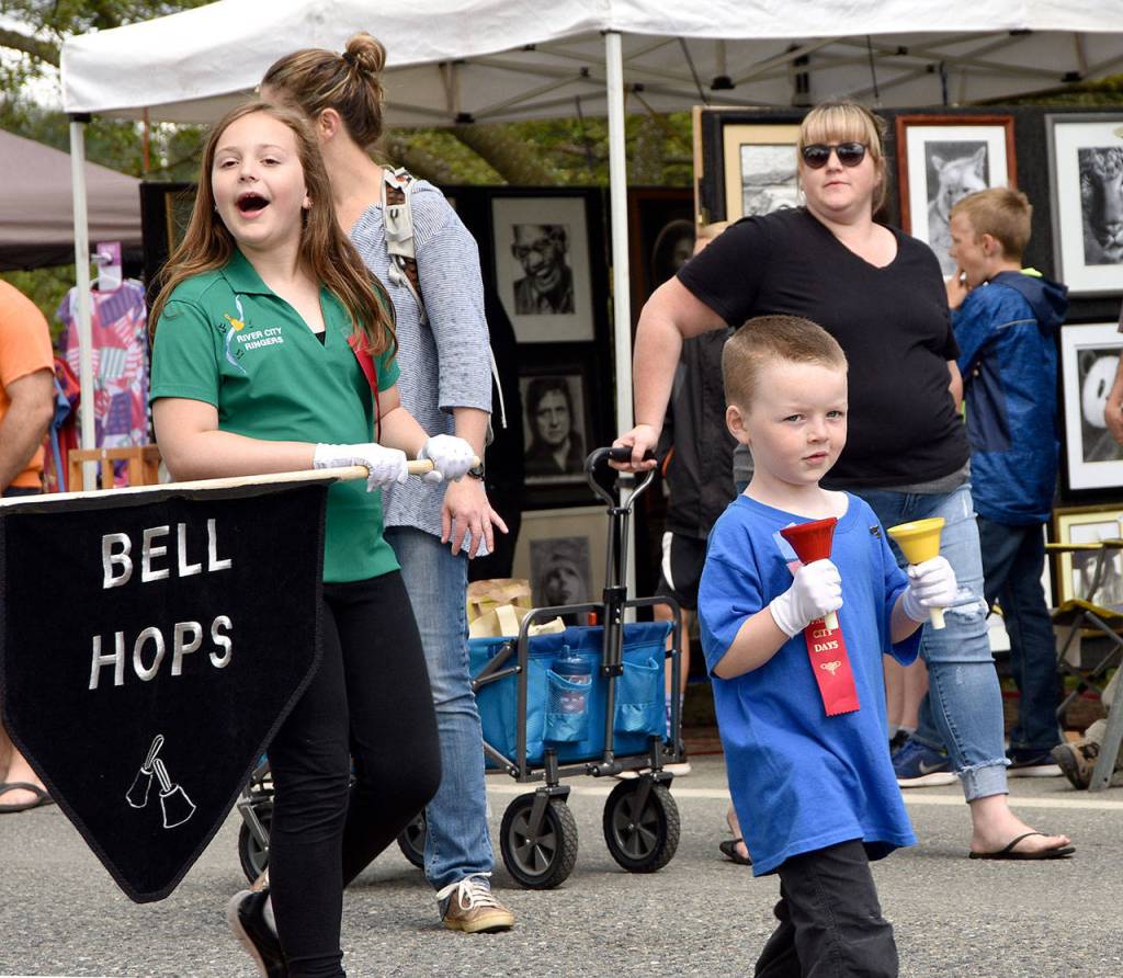 Members of the bell choir, founded by Fall City Day Grand Marshal Marion Querro, followed the Grand Marshals float in the parade.                                Carol Ladwig/Staff Photo