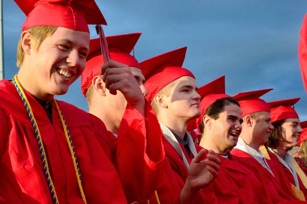 A line of seniors anxiously await the calling of their names to receive their diplomas.                                Mary Miller Photo