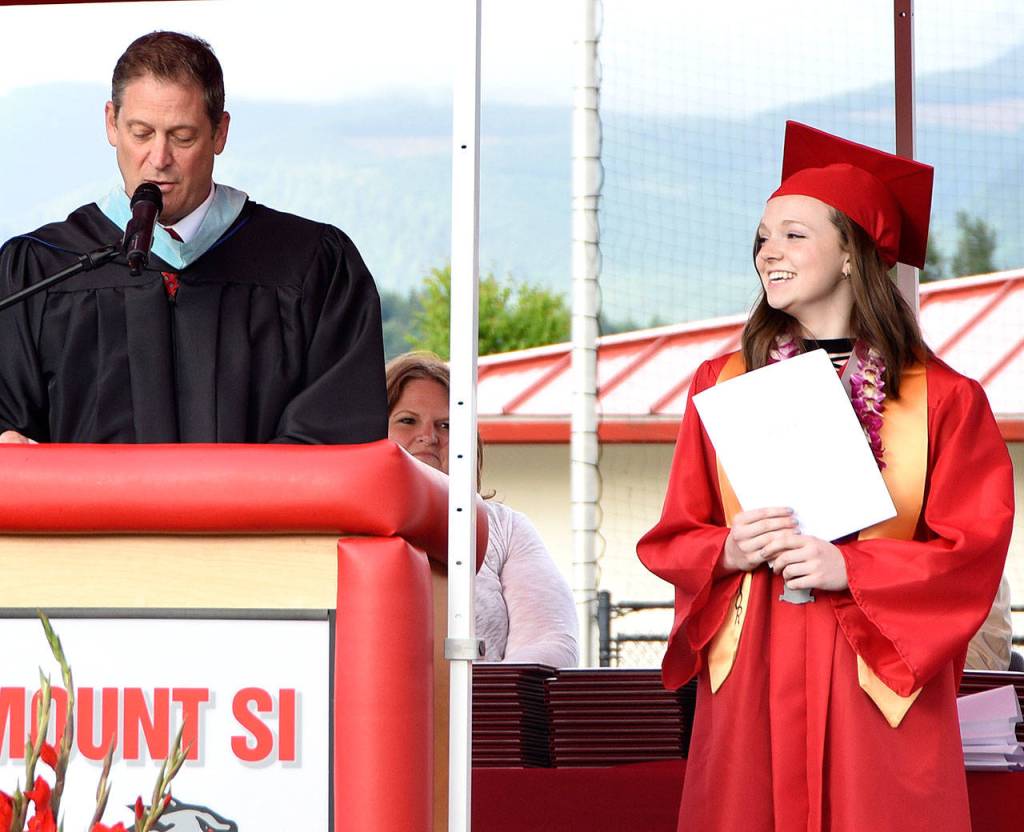 Mount Si High School Principal John Belcher introduced valedictorian Emma Eubanks during graduation.                                Carol Ladwig/Staff Photo