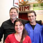 Cory Lewis, right, stands with his parents John and Debbie after graduating.                                (Evan Pappas/Staff Photo)