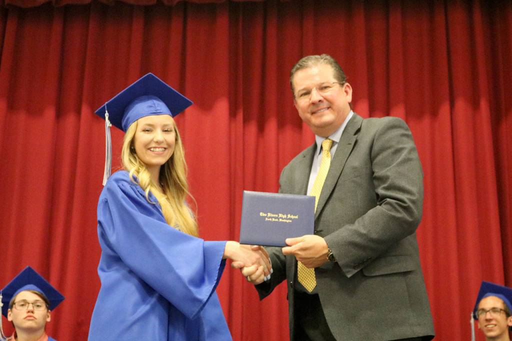 Lola Marum accepts her diploma from Snoqualmie Valley School District Superintendent Joel Aune.                                (Evan Pappas/Staff Photo)