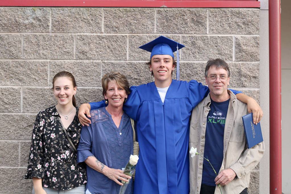 The McCaddon family celebrates after the graduation ceremony. From left, Shelby, Brenda, Colvin and Daniel.                                (Evan Pappas/Staff Photo)