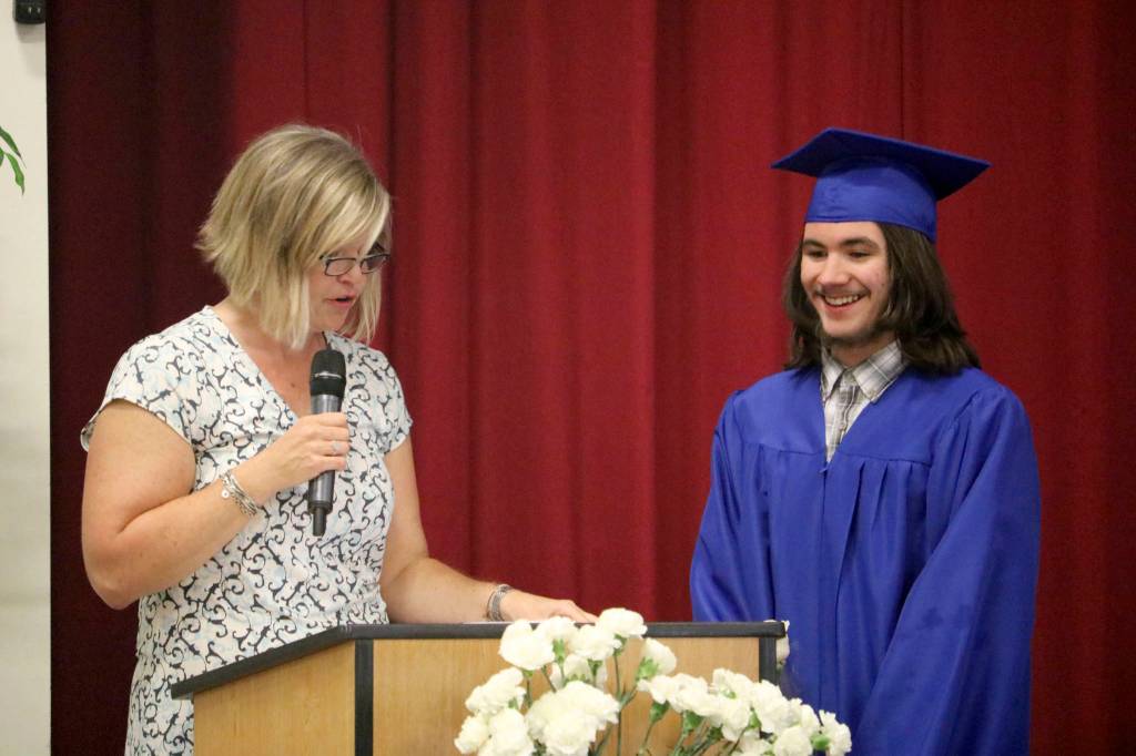 Solomon Pullis is called to the podium to receive a scholarship from the North Bend Masonic Lodge.                                (Evan Pappas/Staff Photo)