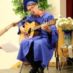 Braeden Sailors performs a song for the audience before accepting his diploma.                                (Evan Pappas/Staff Photo)