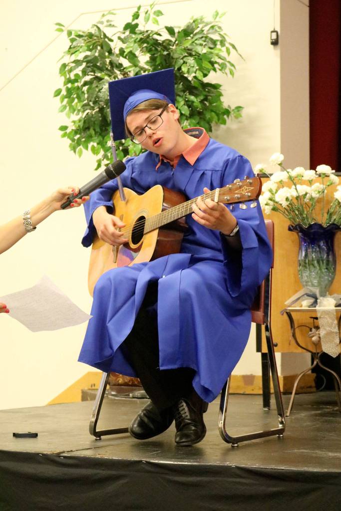 Braeden Sailors performs a song for the audience before accepting his diploma.                                (Evan Pappas/Staff Photo)