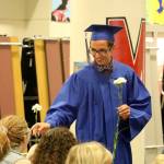 Two Rivers graduates handed flowers to their family and friends during the ceremony.                                (Evan Pappas/Staff Photo)