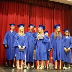 Students walk to the stage and look out into the audience full of family, friends and Two Rivers staff.                                (Evan Pappas/Staff Photo)