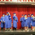 The students all turn their tassels to signify their graduation.                                (Evan Pappas/Staff Photo)