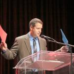 Cedarcrest teacher Dan Armstrong asks students to pick the red or blue folders, which he said contain different speeches.                                (Evan Pappas/Staff Photo)